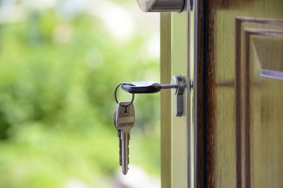 Keys hanging in the lock of a front door